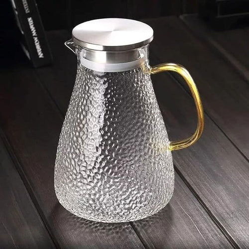 Golden handle glass pitcher