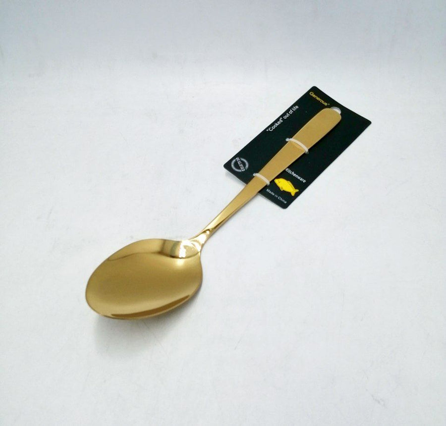 Gold serving spoon